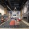 Co-working lounge showing open areas, a fireplace, and ample seating