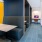 Co-Working space with booth seating and a MacBook computer